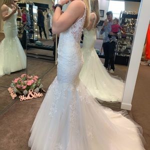 Wedding dress.  Size 6. It was fitted for me. Height: 5’3 Weight 115 pounds